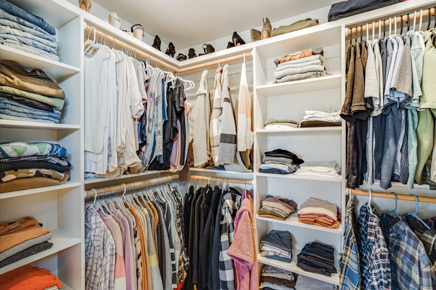 14150 Reservation Road Salinas, CA 93908 - Photo 21 of 47 a view of walk in closet with clothes and shoes