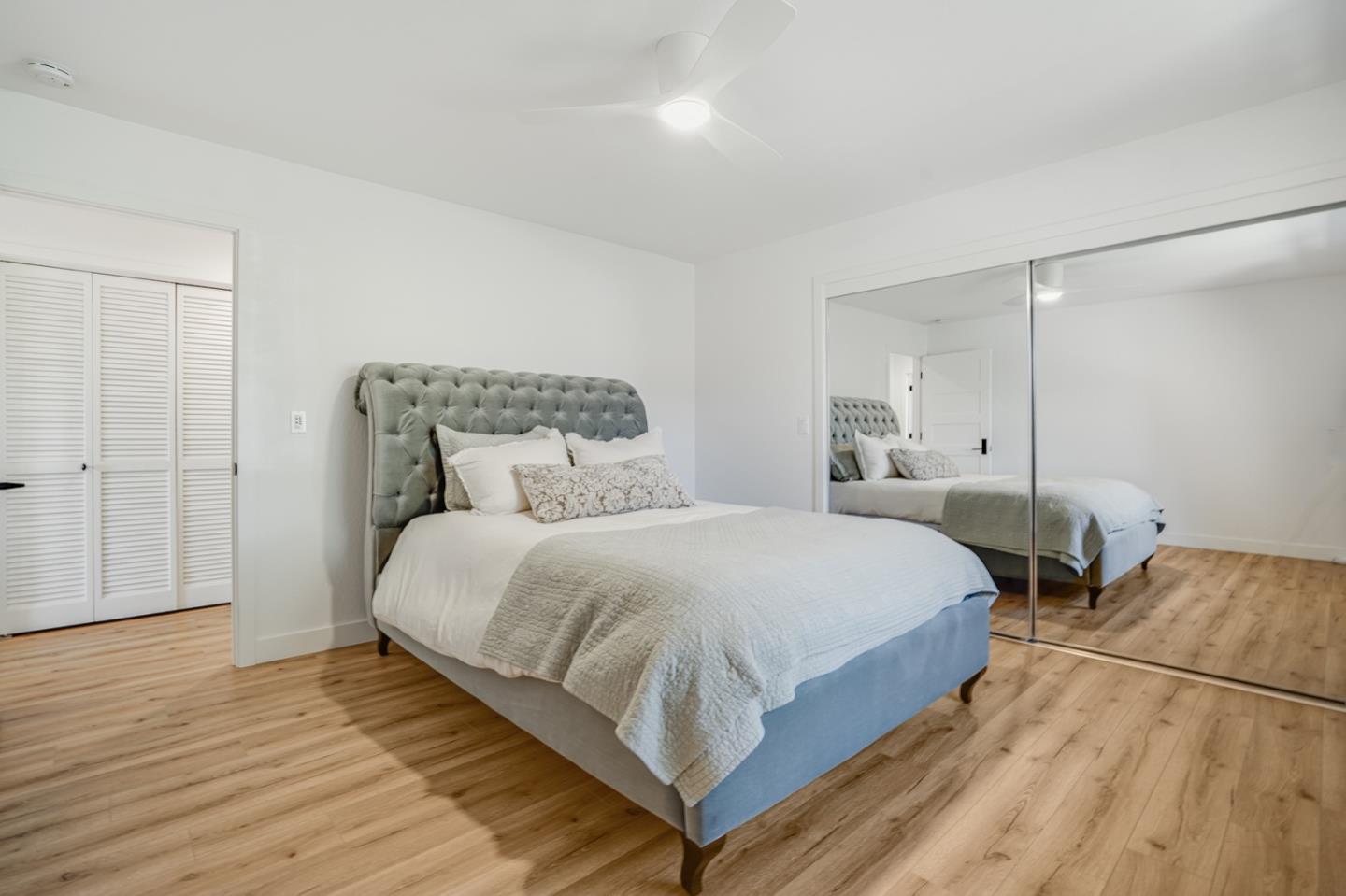 14150 Reservation Road Salinas, CA 93908 - Photo 25 of 47 a bedroom with a bed and wooden floor