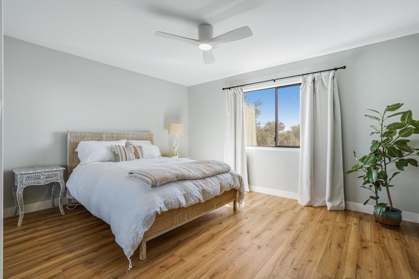 14150 Reservation Road Salinas, CA 93908 - Photo 28 of 47 a bedroom with a bed and a potted plant