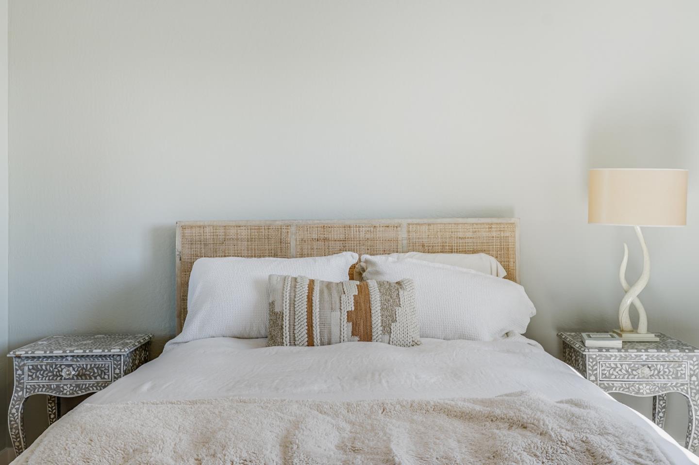 14150 Reservation Road Salinas, CA 93908 - Photo 29 of 47 a bedroom with a bed and a lamp with the wall