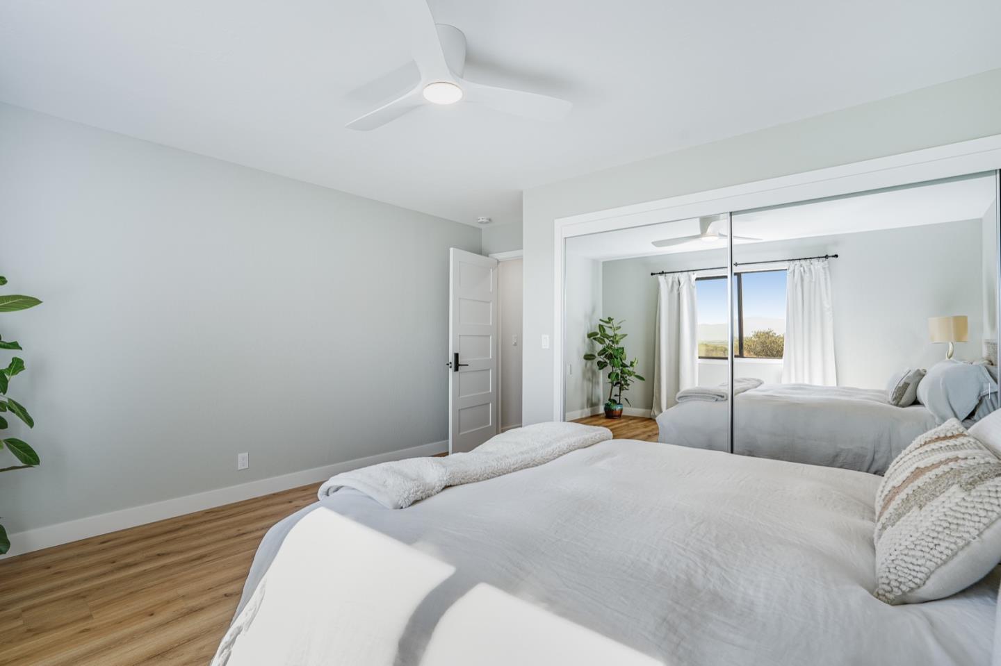 14150 Reservation Road Salinas, CA 93908 - Photo 30 of 47 a bedroom with a large bed and potted plant