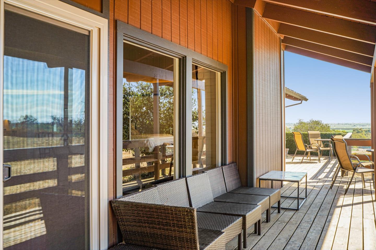 14150 Reservation Road Salinas, CA 93908 - Photo 31 of 47 a view of a balcony with floor to ceiling windows with wooden floor