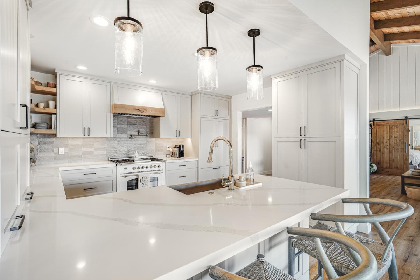 14150 Reservation Road Salinas, CA 93908 - Photo 7 of 47 a kitchen with a table chairs stove and cabinets