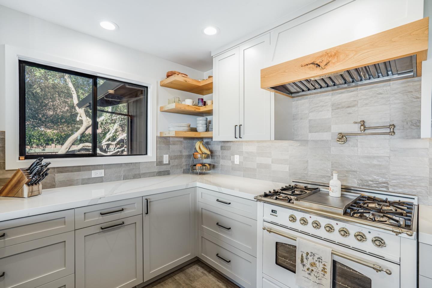 14150 Reservation Road Salinas, CA 93908 - Photo 9 of 47 a kitchen with cabinets appliances and a large window