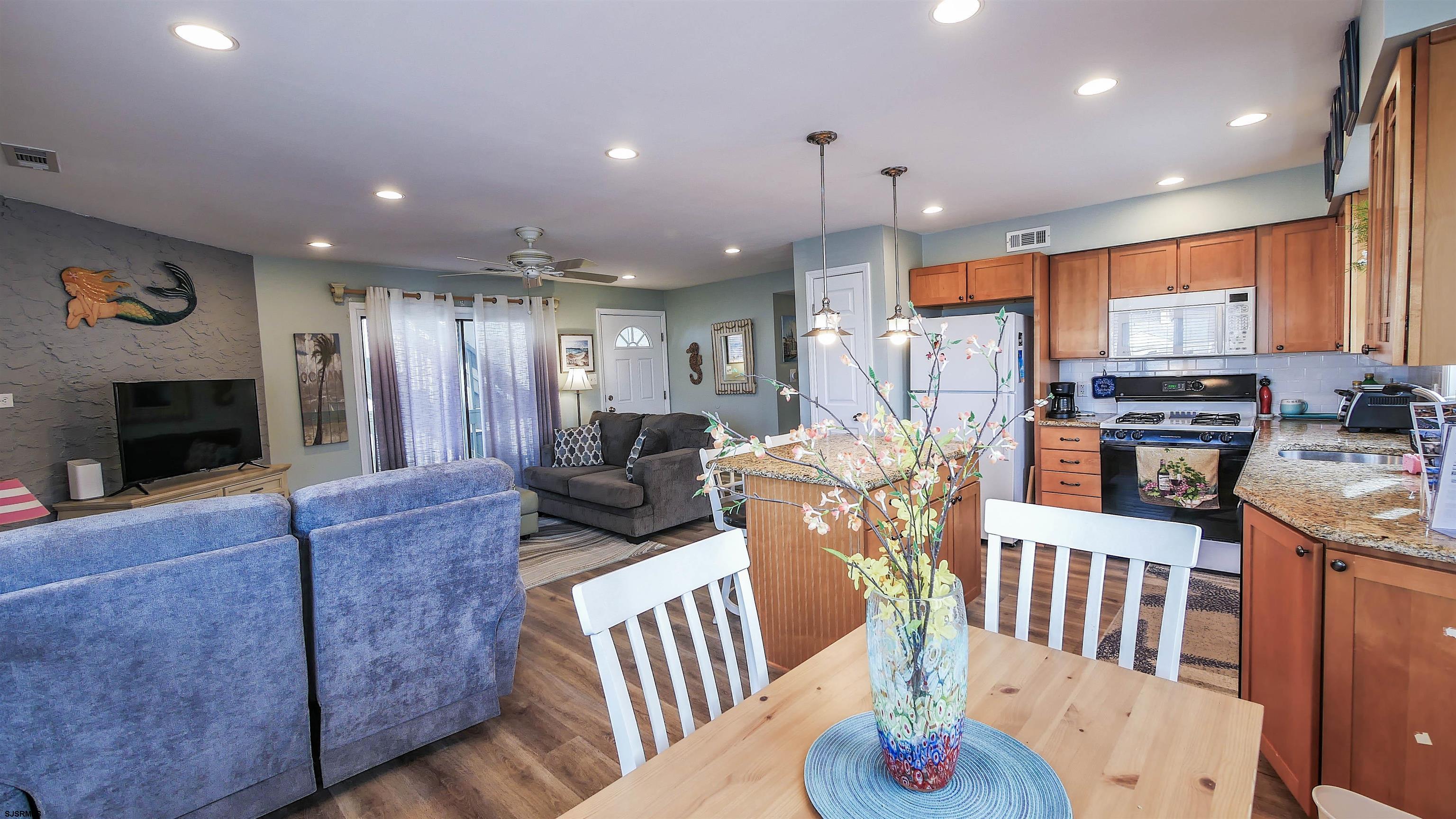 4318 West Brigantine Avenue, Unit D1 Brigantine, NJ 08203 - Photo 8 of 30 a living room with furniture kitchen and a fireplace