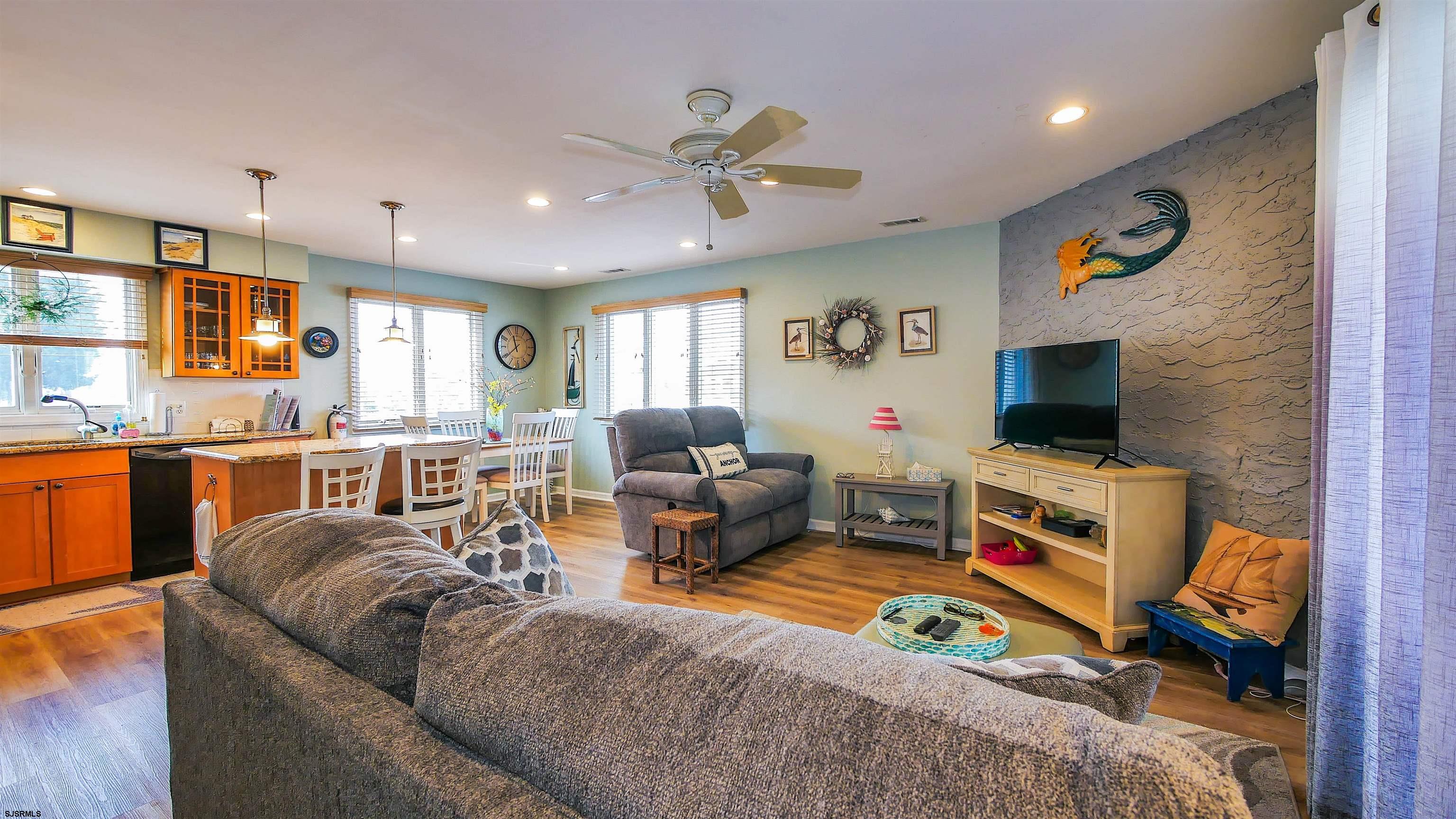 4318 West Brigantine Avenue, Unit D1 Brigantine, NJ 08203 - Photo 9 of 30 a living room with furniture and a flat screen tv