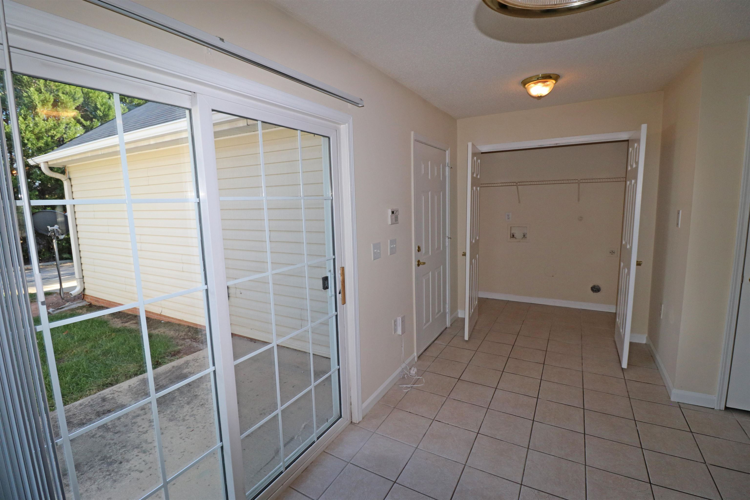 11371 Involute Place, Unit 103 Raleigh, NC 27617 - Photo 11 of 34 a view of an empty room with a window