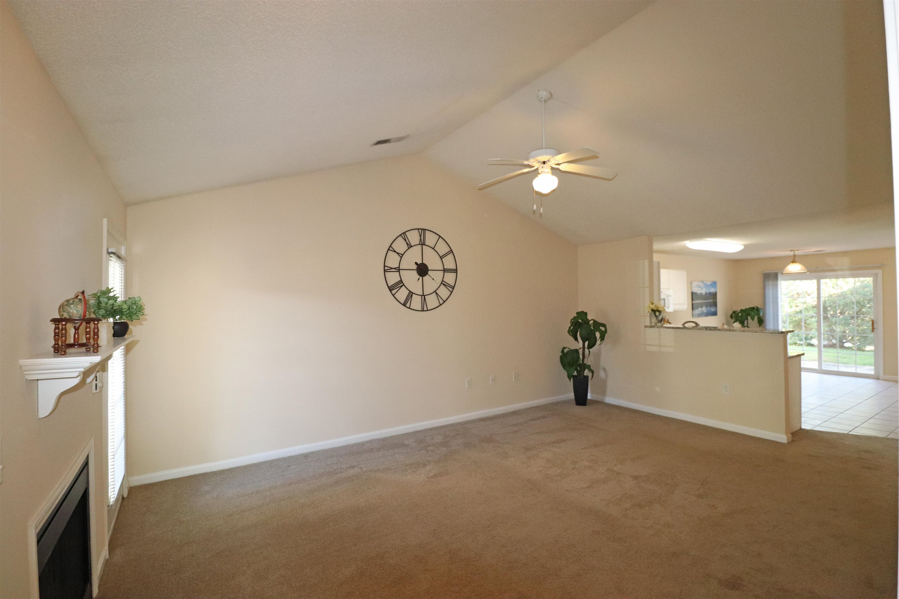 11371 Involute Place, Unit 103 Raleigh, NC 27617 - Photo 2 of 34 a view of a room with a ceiling fan and window