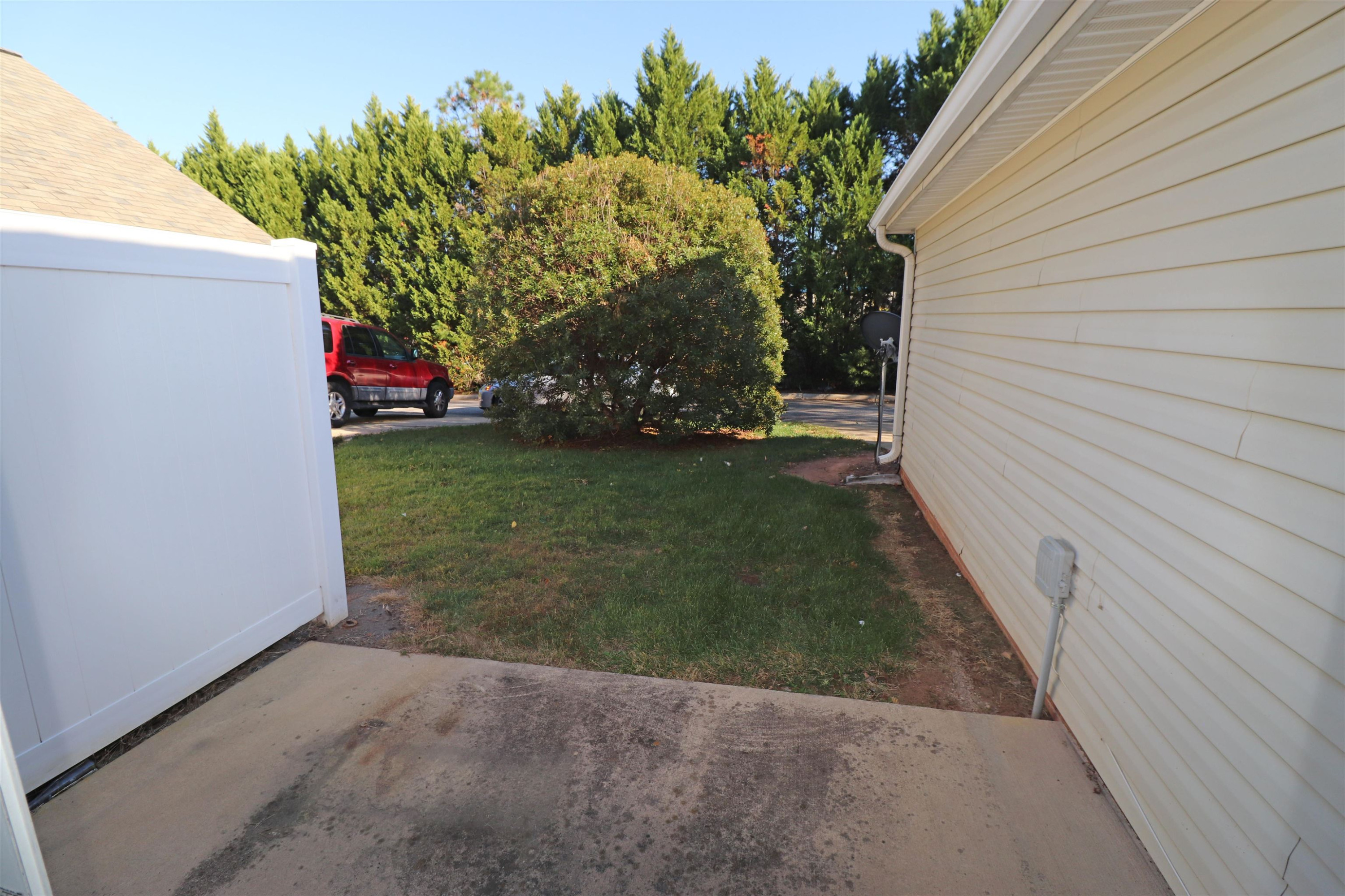 11371 Involute Place, Unit 103 Raleigh, NC 27617 - Photo 31 of 34 a backyard of a house with lots of green space