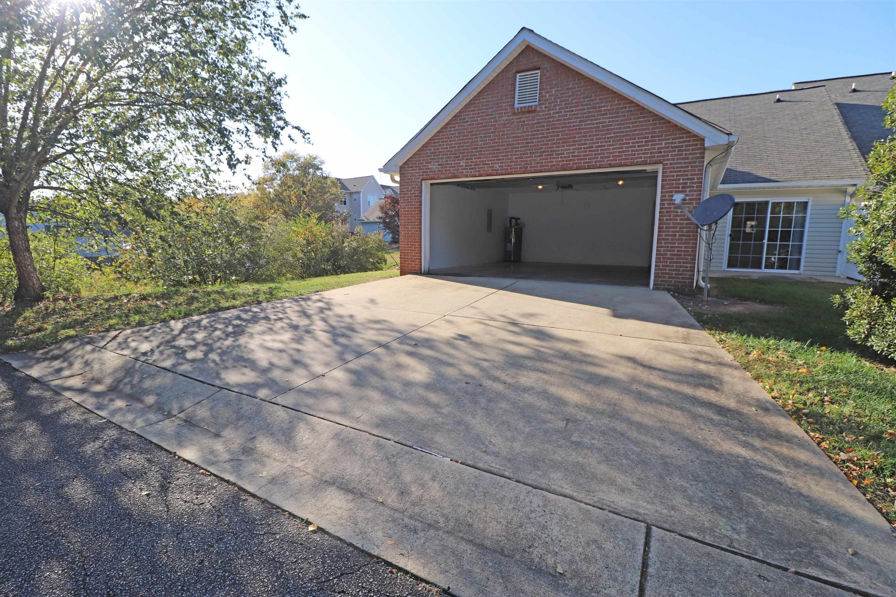 11371 Involute Place, Unit 103 Raleigh, NC 27617 - Photo 33 of 34 a front view of a house with a yard and garage