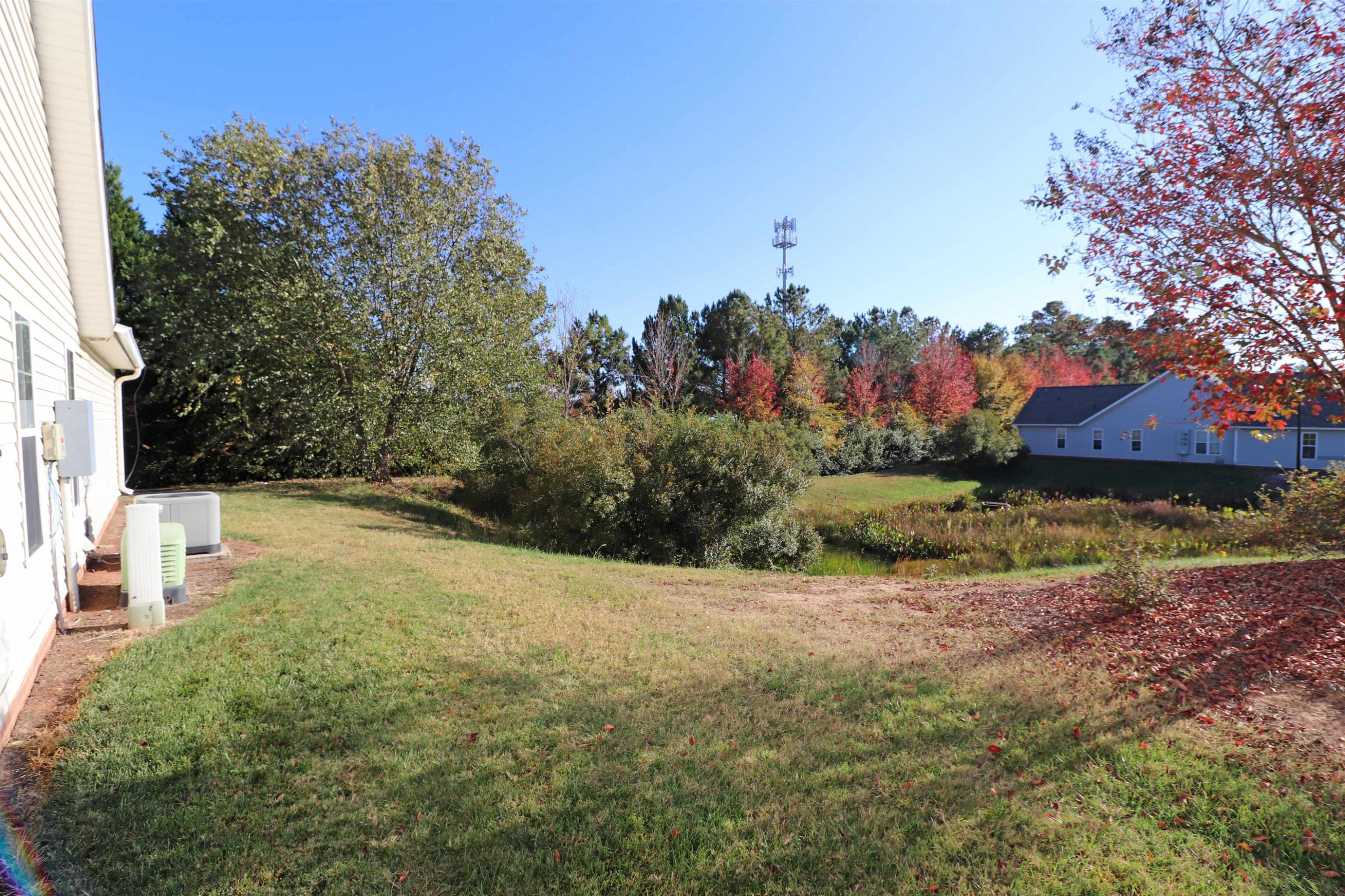 11371 Involute Place, Unit 103 Raleigh, NC 27617 - Photo 34 of 34 a view of a yard with palm tree
