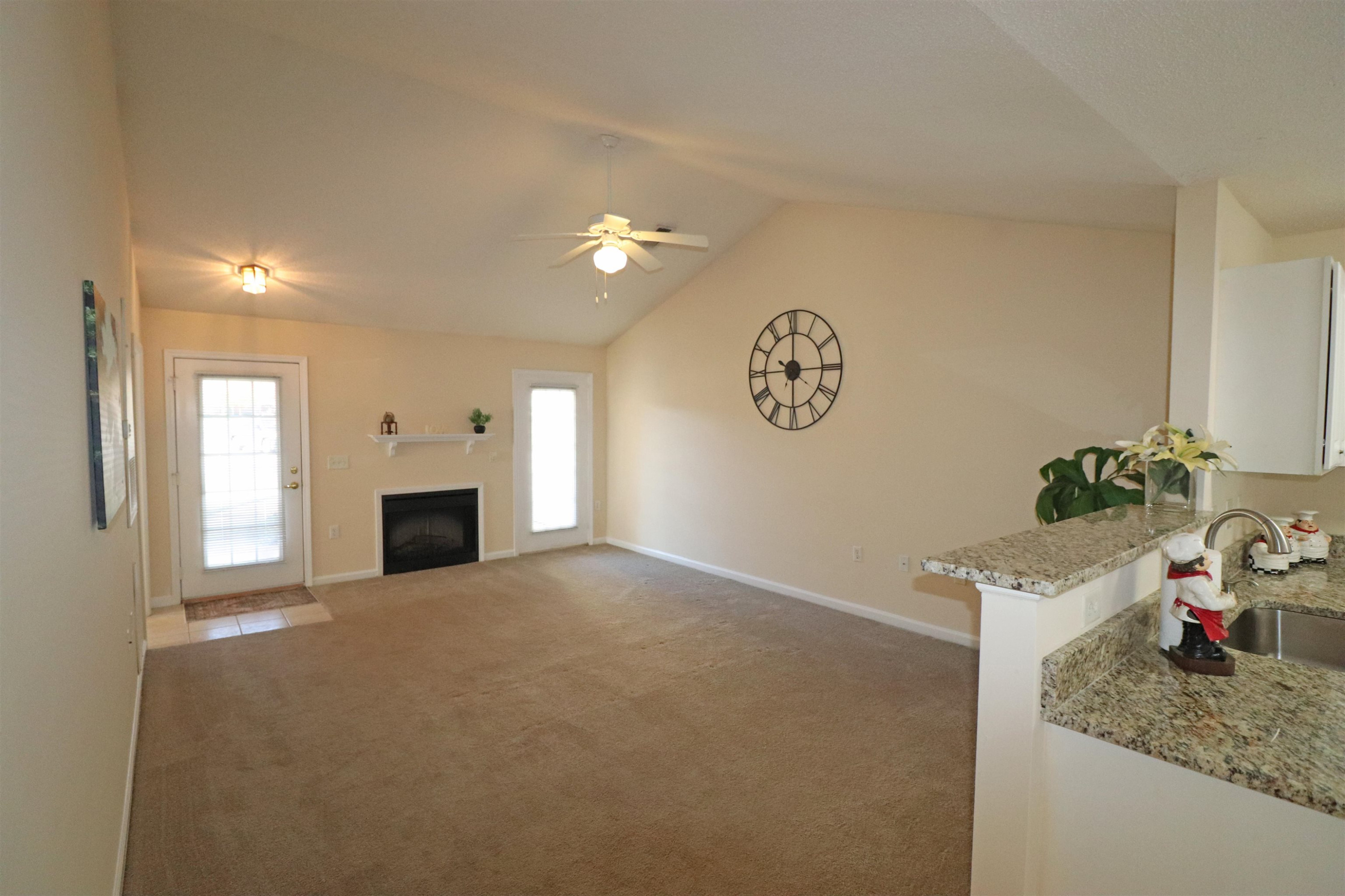 11371 Involute Place, Unit 103 Raleigh, NC 27617 - Photo 4 of 34 a view of a kitchen cabinets and a bed