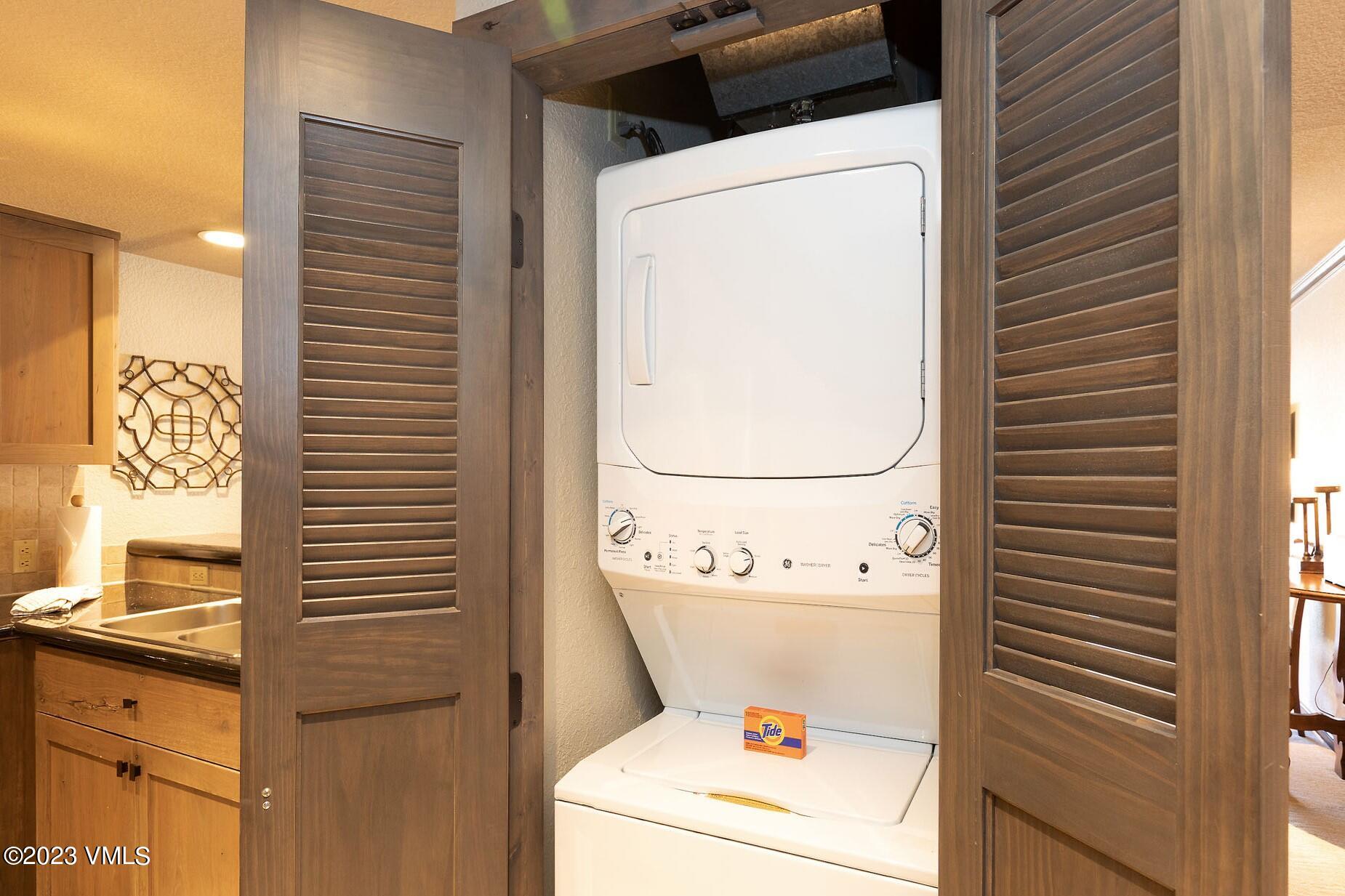 210 Offerson Road, Unit 209 WEEK 30 Beaver Creek, CO 81620 - Photo 11 of 27 a utility room with dryer and washer