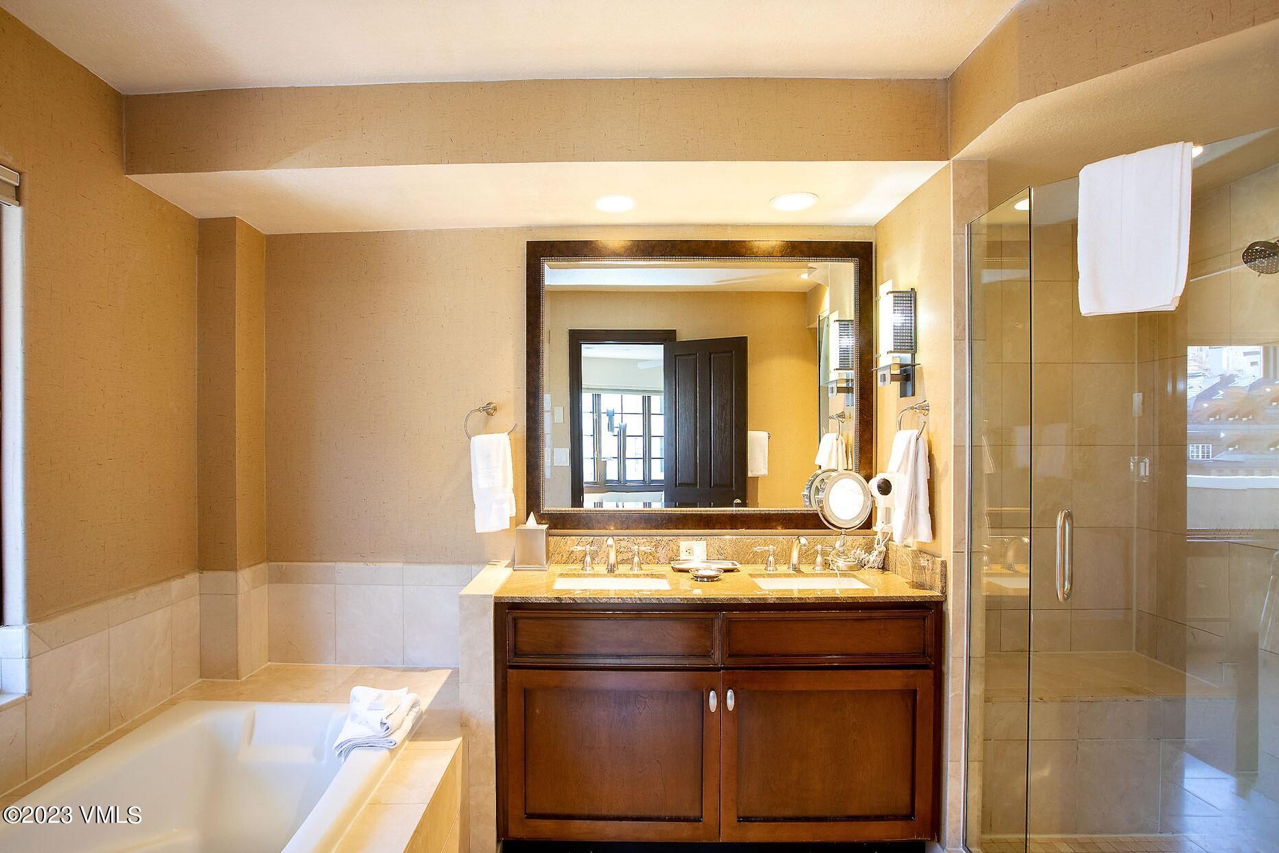 210 Offerson Road, Unit 209 WEEK 30 Beaver Creek, CO 81620 - Photo 16 of 27 a bathroom with a bathtub and a sink