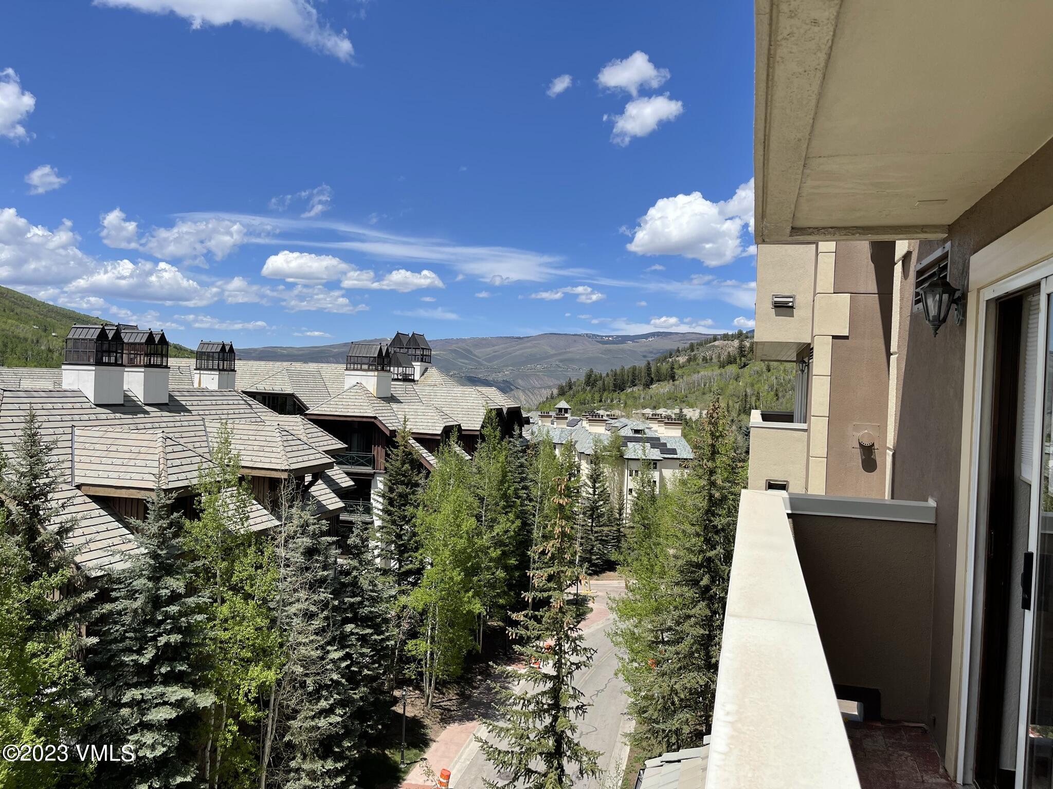 210 Offerson Road, Unit 209 WEEK 30 Beaver Creek, CO 81620 - Photo 5 of 27 a view of a patio with plants and a fountain