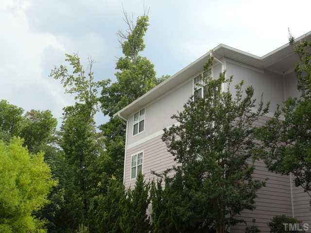 929 Morreene Road, Unit C34 Durham, NC 27705 - Photo 22 of 23 Unit C34 is the top level of building C (shown in photo)-you can see how it is nestled into the trees very nicely. Very appealling to tenants. Exterior Back
