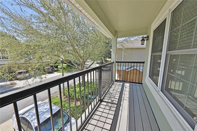 a view of balcony with wooden floor