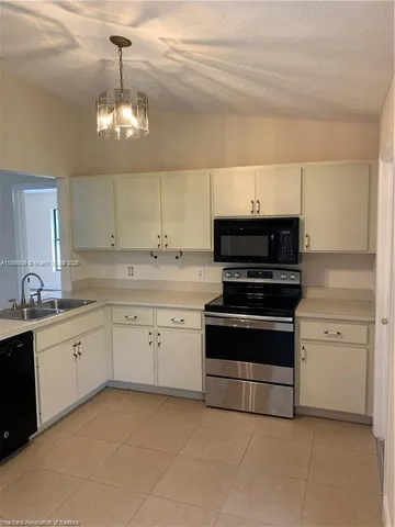 a kitchen with a stove and cabinets