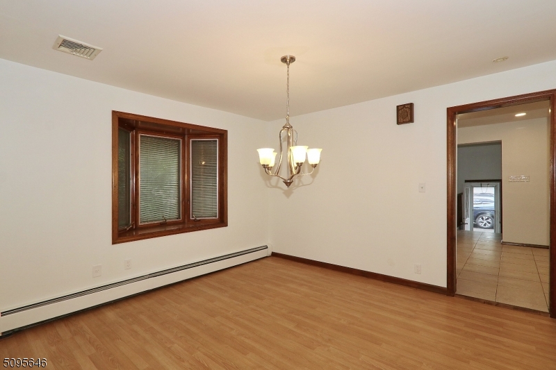 2 Gates Avenue, Unit A Summit, NJ 07901 - Photo 12 of 19 a view of a room with wooden floor chandelier and windows