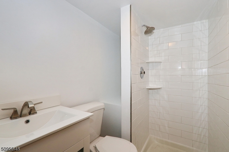 2 Gates Avenue, Unit A Summit, NJ 07901 - Photo 17 of 19 a bathroom with a sink a toilet and shower