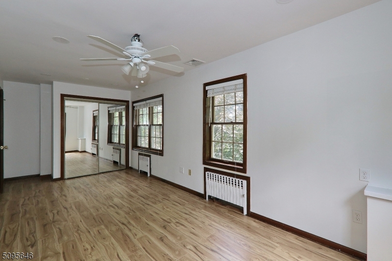 2 Gates Avenue, Unit A Summit, NJ 07901 - Photo 18 of 19 a view of an empty room with wooden floor and a window