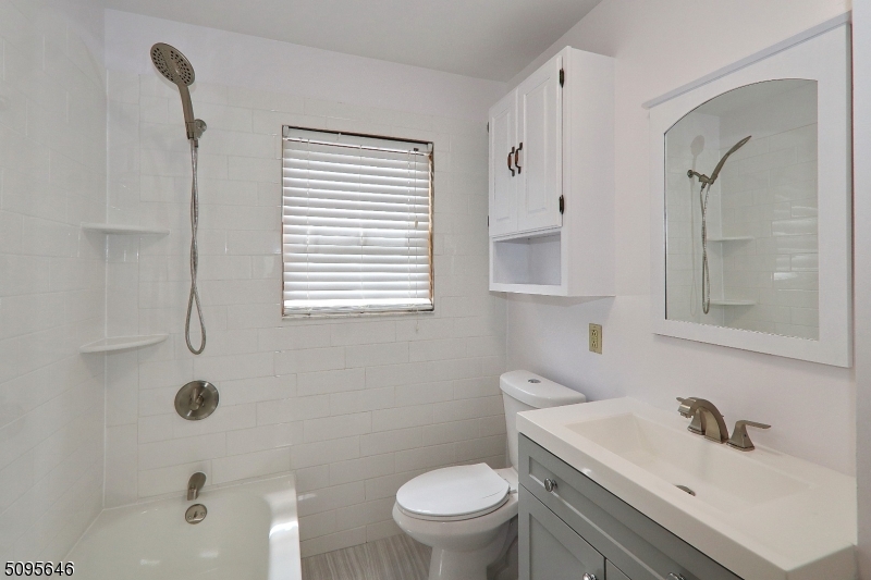 2 Gates Avenue, Unit A Summit, NJ 07901 - Photo 7 of 19 a bathroom with a sink a toilet and shower