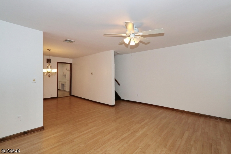 2 Gates Avenue, Unit A Summit, NJ 07901 - Photo 10 of 19 an empty room with wooden floor fan and windows