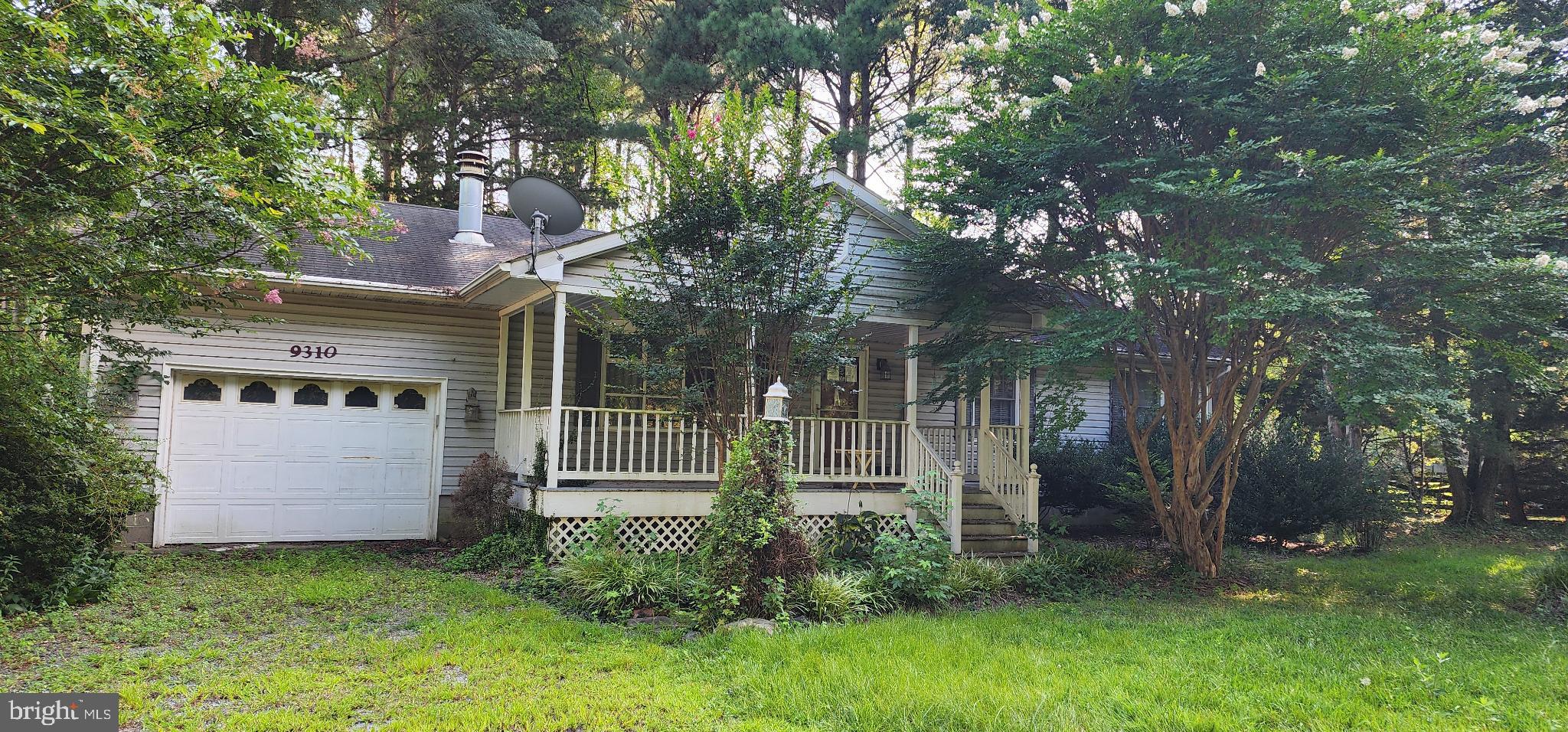 Charming home nestled in lush greenery.