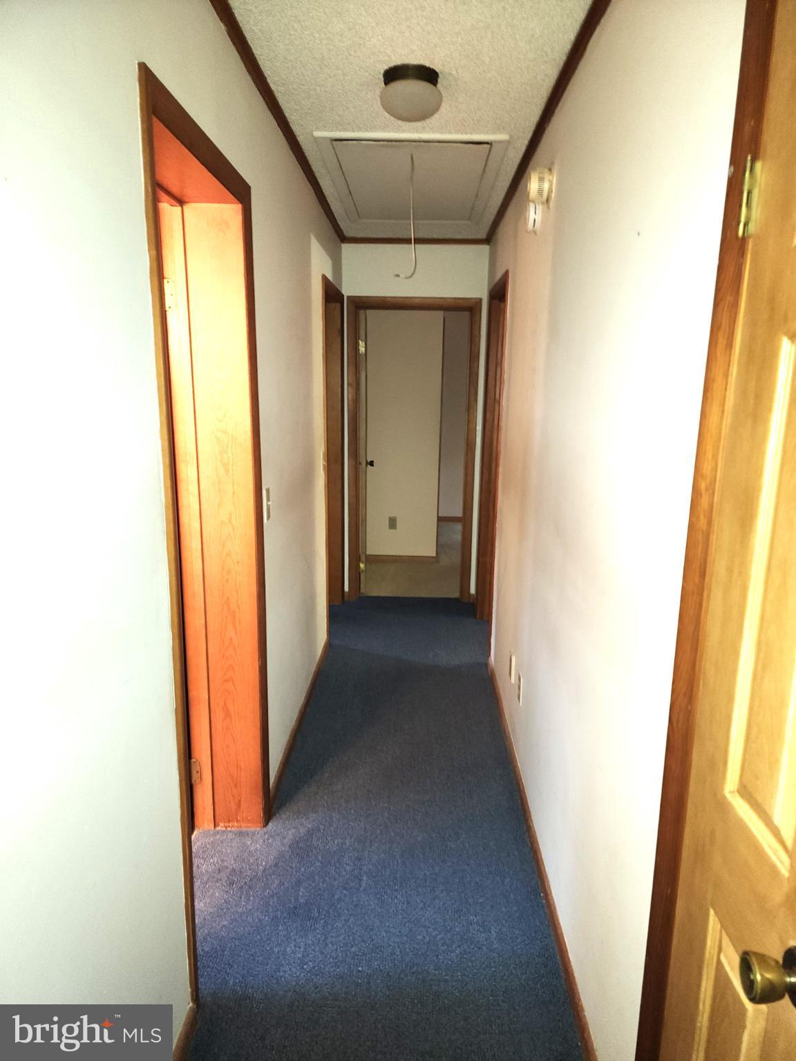 9310 Romancoke Road Stevensville, MD 21666 - Photo 12 of 35 a view of hallway with stairs