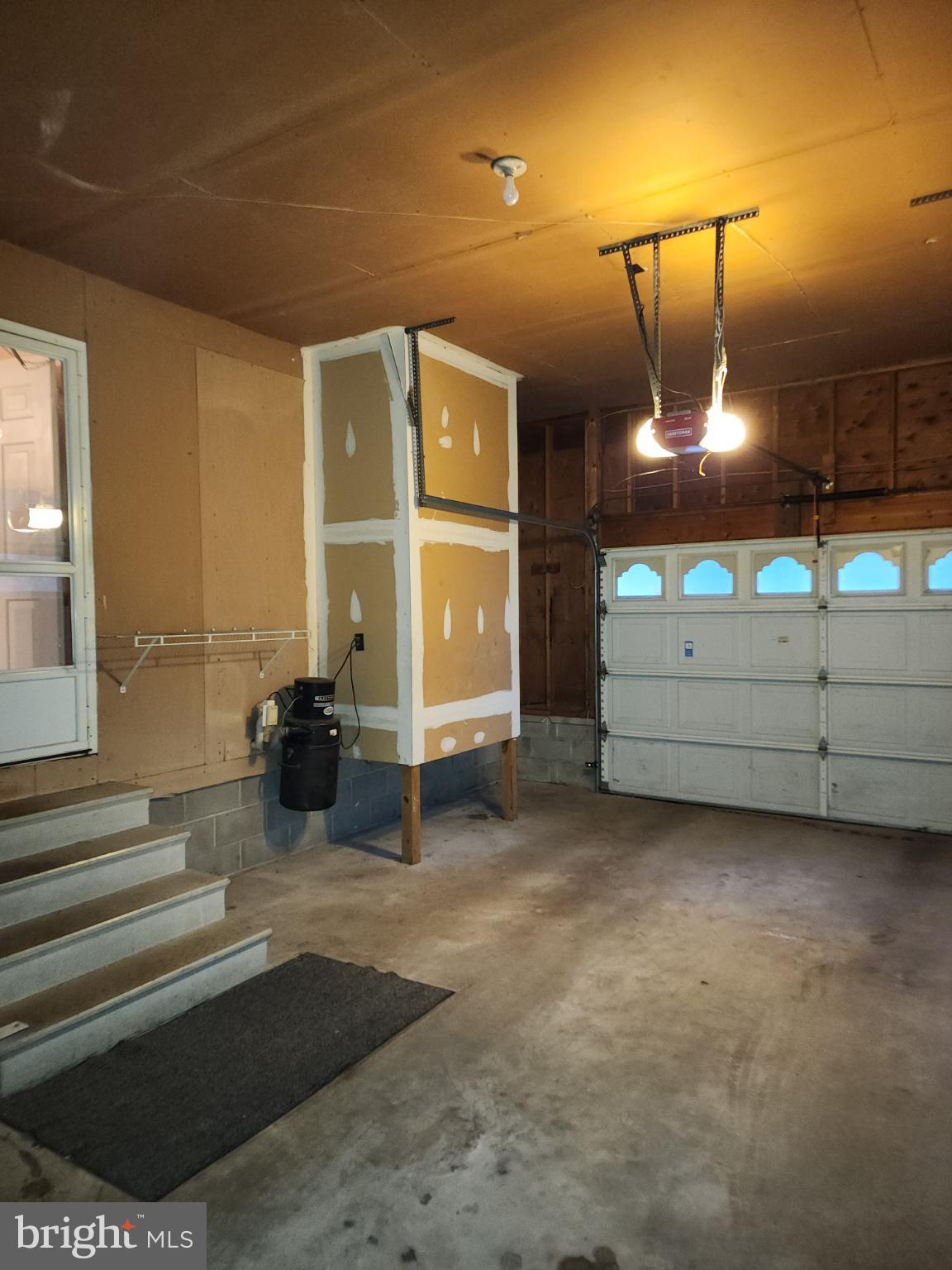 9310 Romancoke Road Stevensville, MD 21666 - Photo 23 of 35 a view of a room with gym equipment and a large window