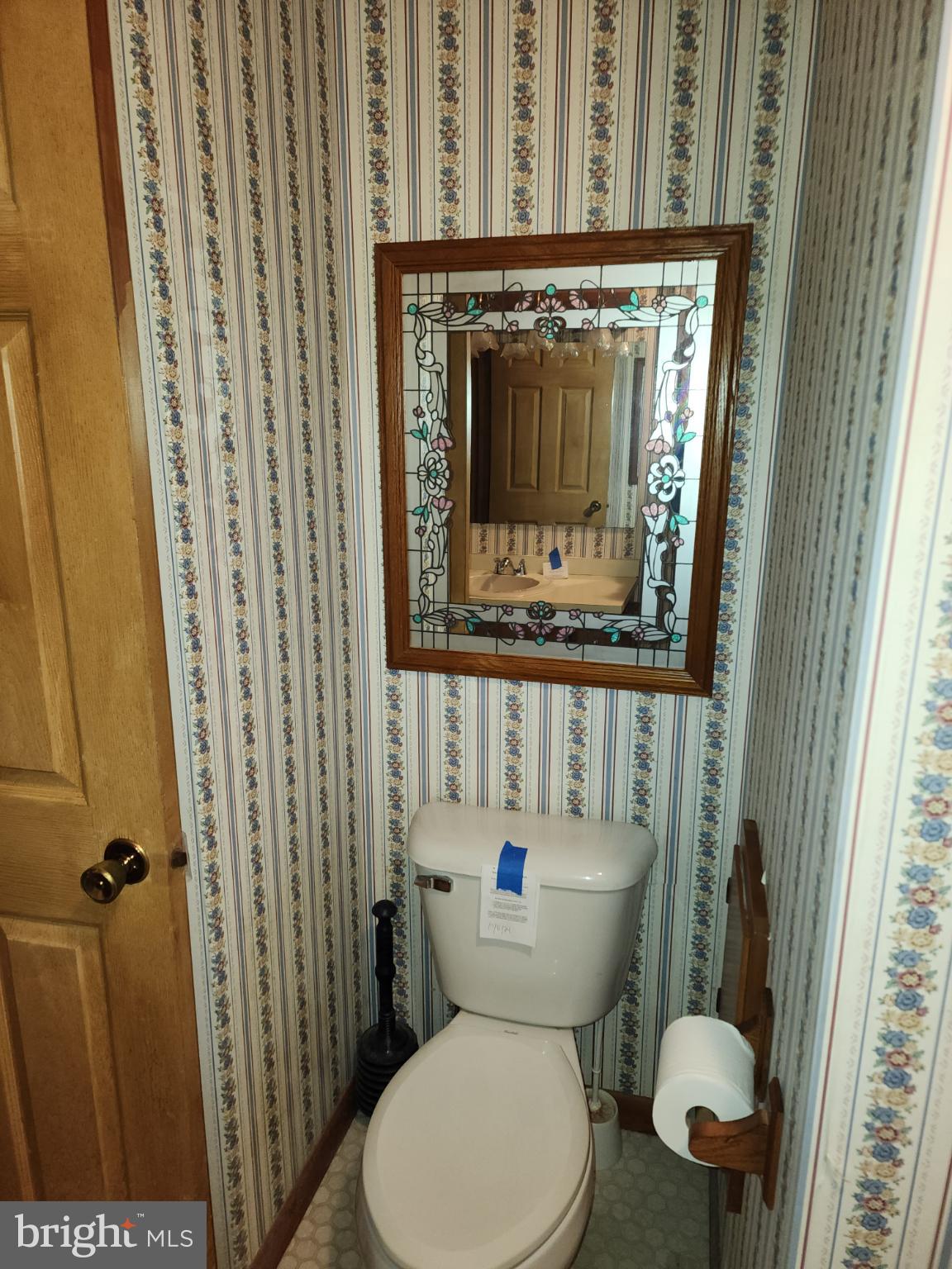 9310 Romancoke Road Stevensville, MD 21666 - Photo 29 of 35 a bathroom with a toilet and a sink