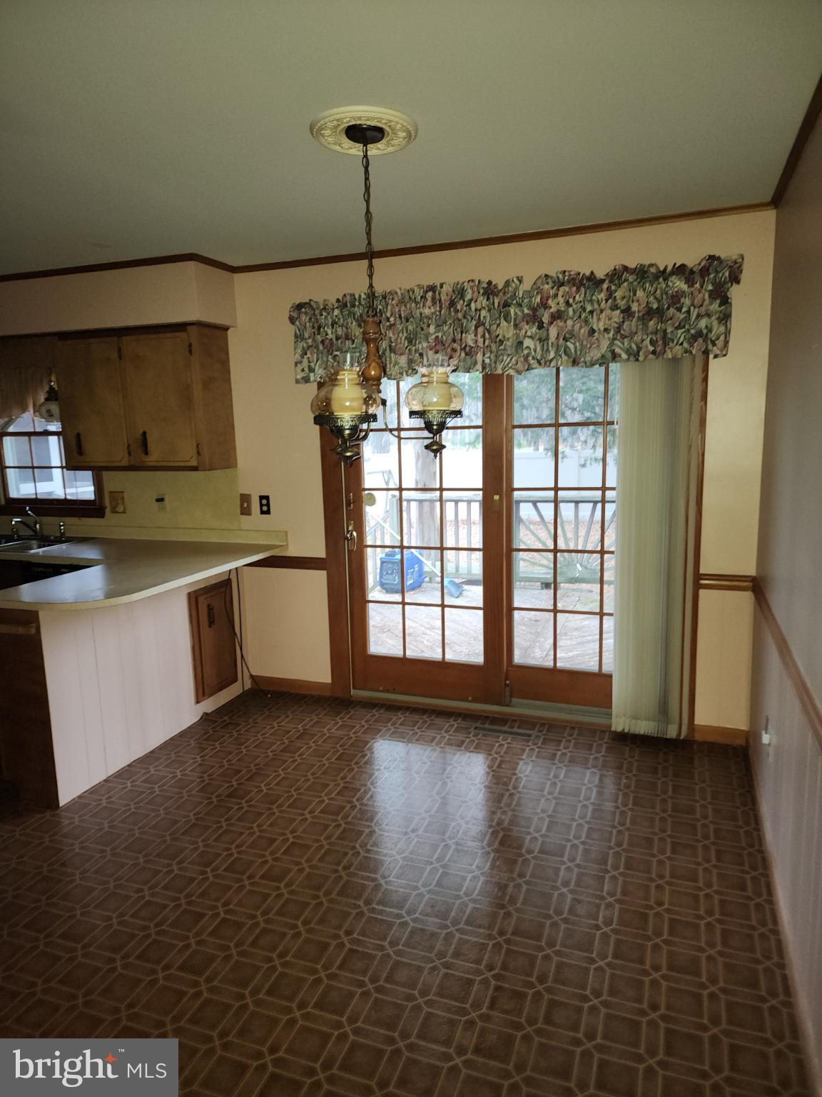 9310 Romancoke Road Stevensville, MD 21666 - Photo 30 of 35 a view of an empty room with window and wooden floor