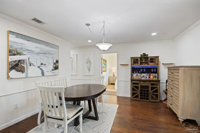 a kitchen with kitchen island granite countertop a sink counter top space appliances and cabinets