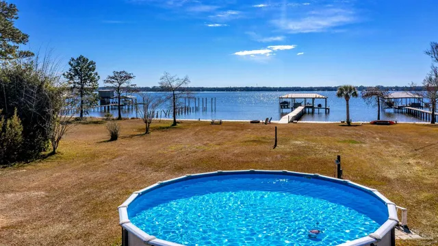 a view of a balcony with chair and wooden floor