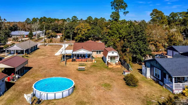 a view of roof deck with chair and wooden floor