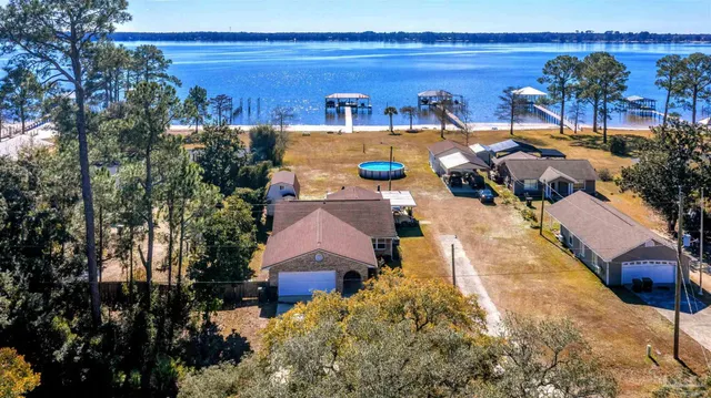 a view of a living room with furniture and wooden floor