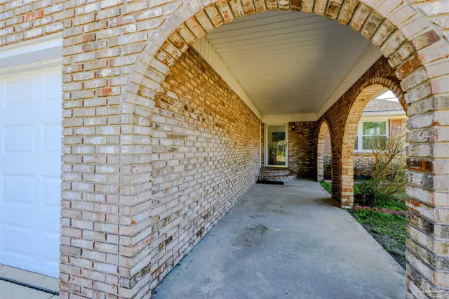 a view of ocean with large trees