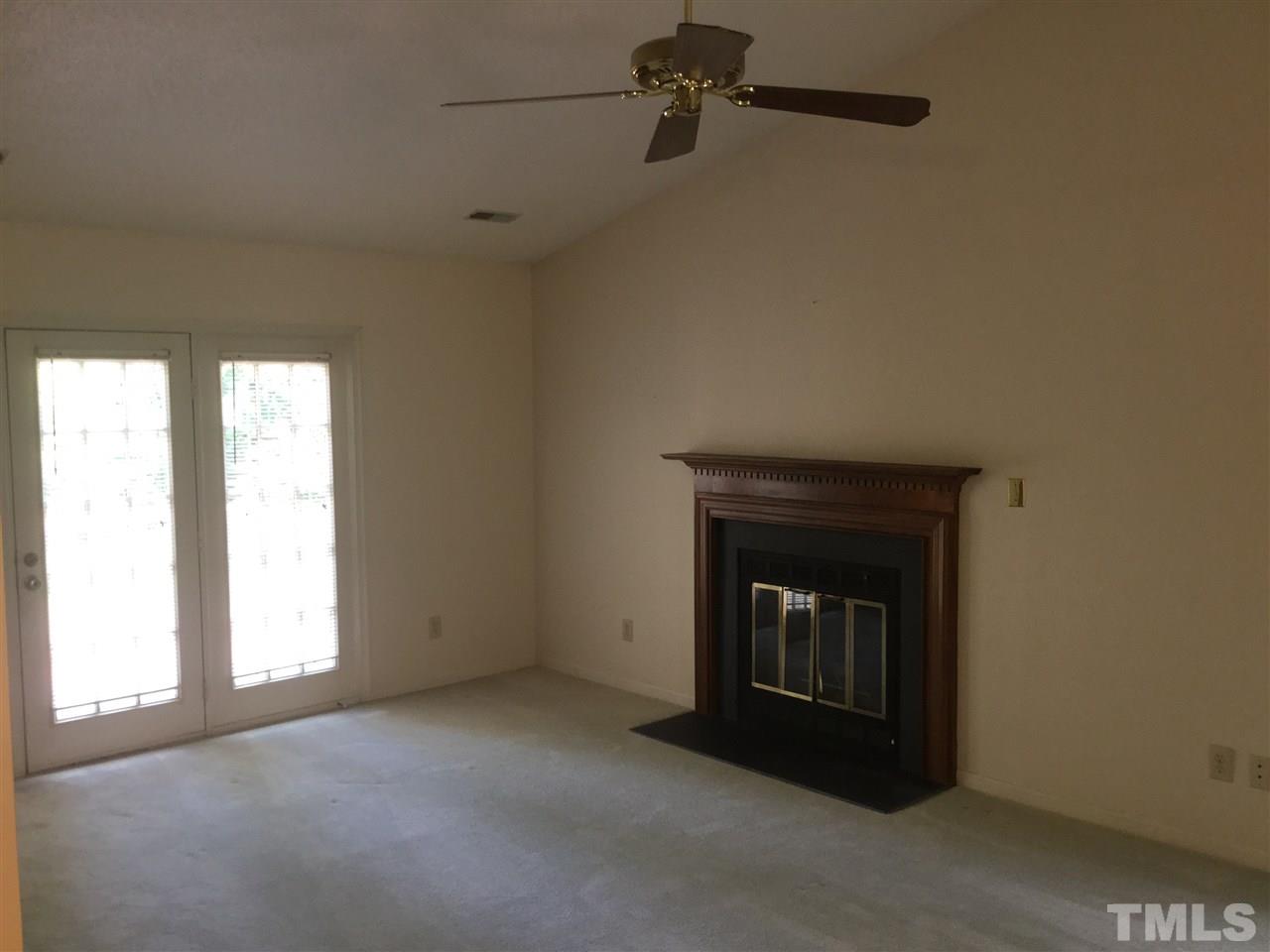4405 Lake Ridge Drive Raleigh, NC 27604 - Photo 5 of 12 a view of empty room with a fireplace