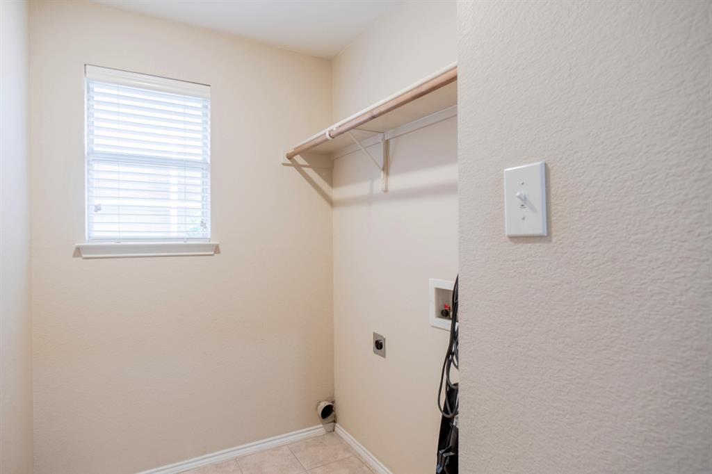 4929 Spur Ridge Court Fort Worth, TX 76244 - Photo 28 of 34 a bathroom with a window and a shower