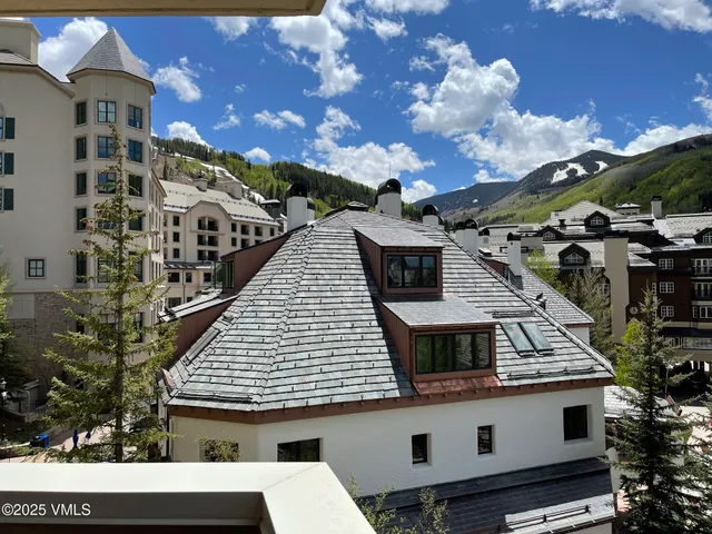a aerial view of a house with a balcony