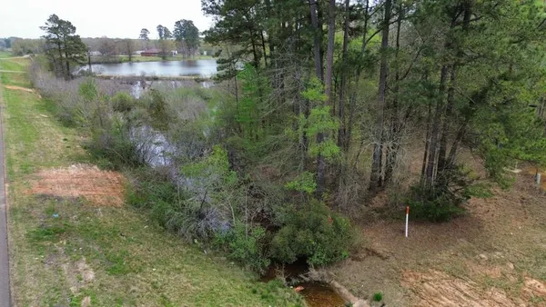 a view of a lake and green space