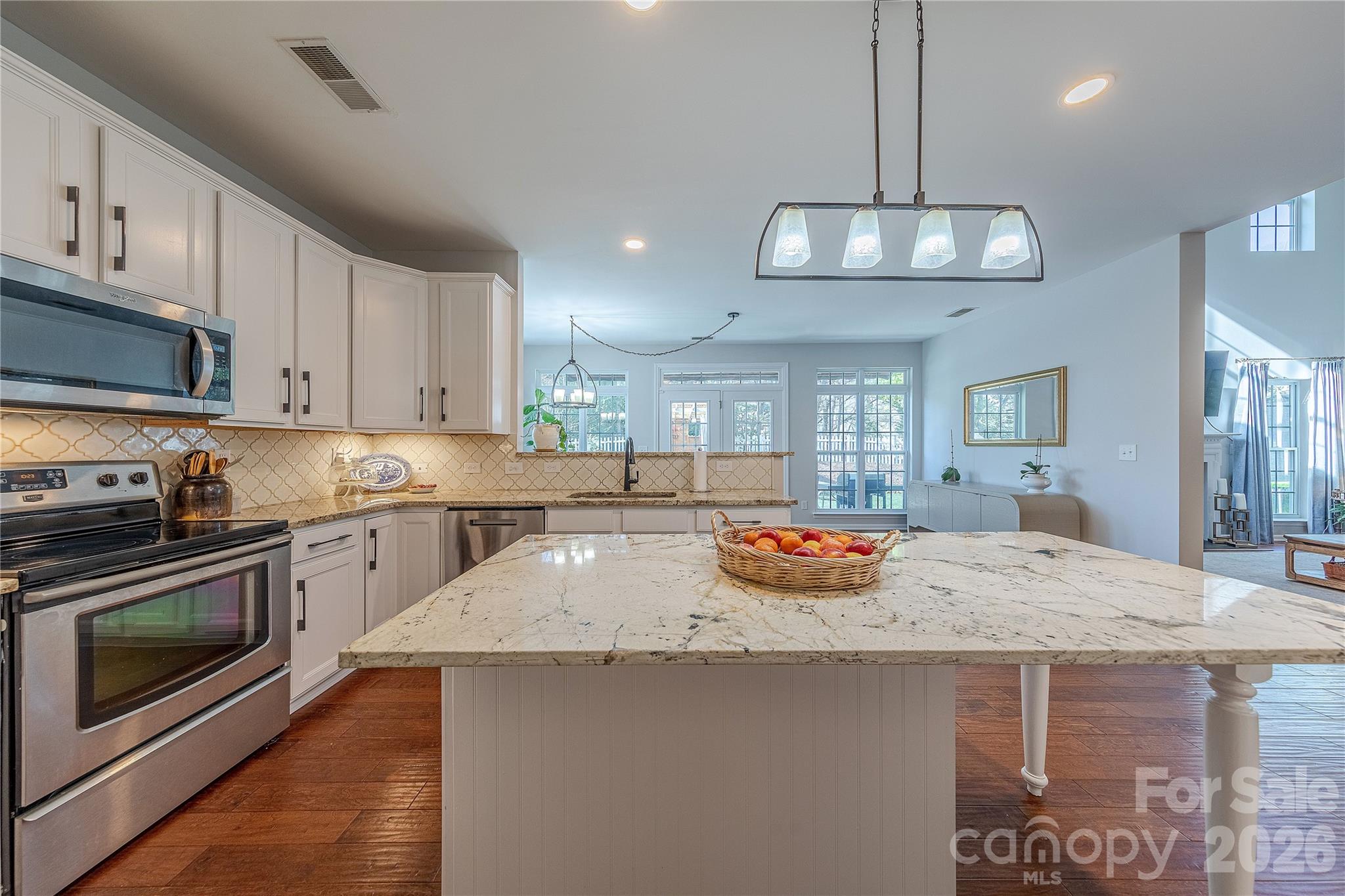 5919 Summer Fog End Fort Mill, SC 29708 - Photo 15 of 41 a kitchen with stainless steel appliances granite countertop a sink and stove