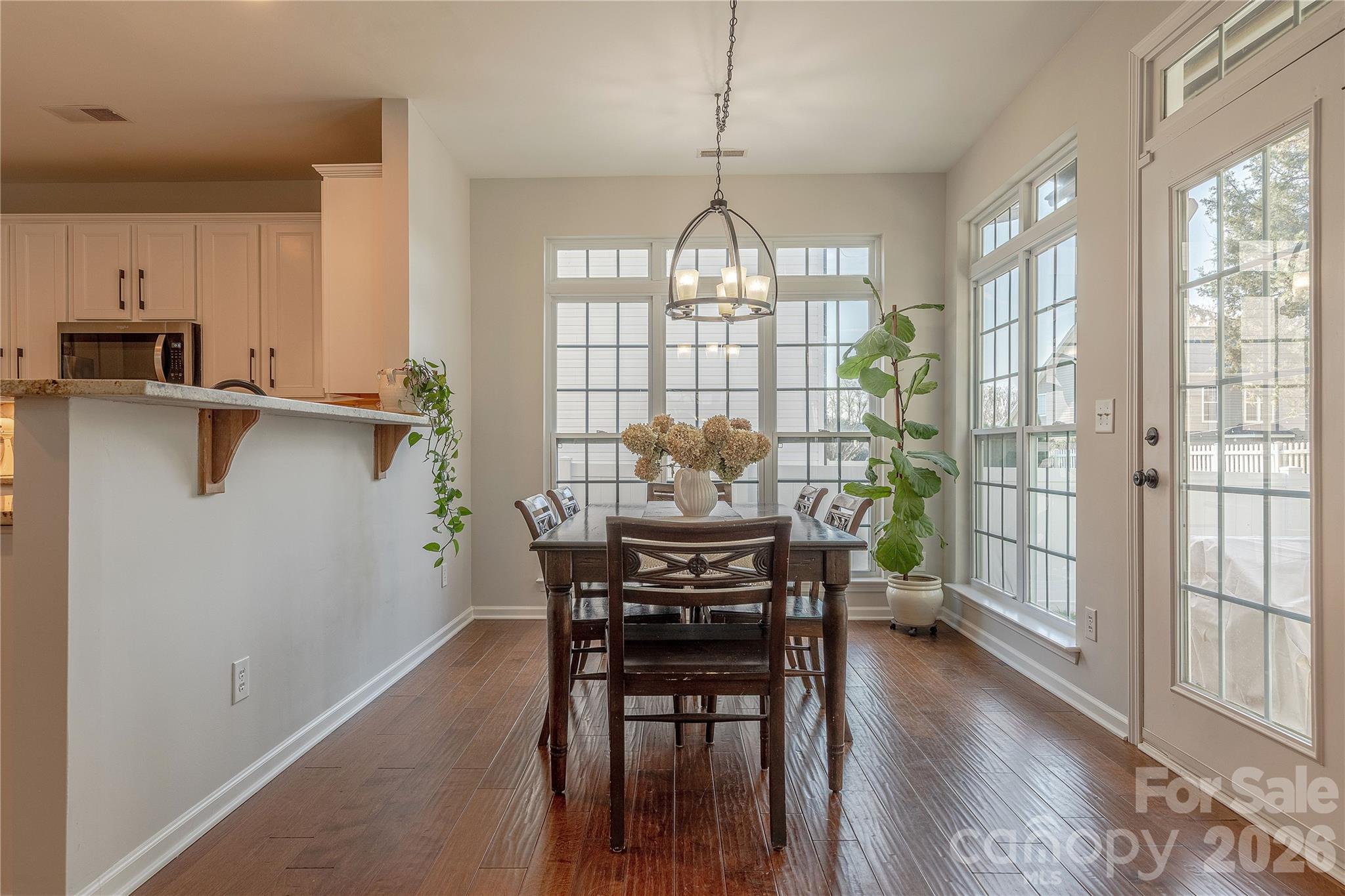 5919 Summer Fog End Fort Mill, SC 29708 - Photo 19 of 41 a view of a dining room with furniture window and wooden floor