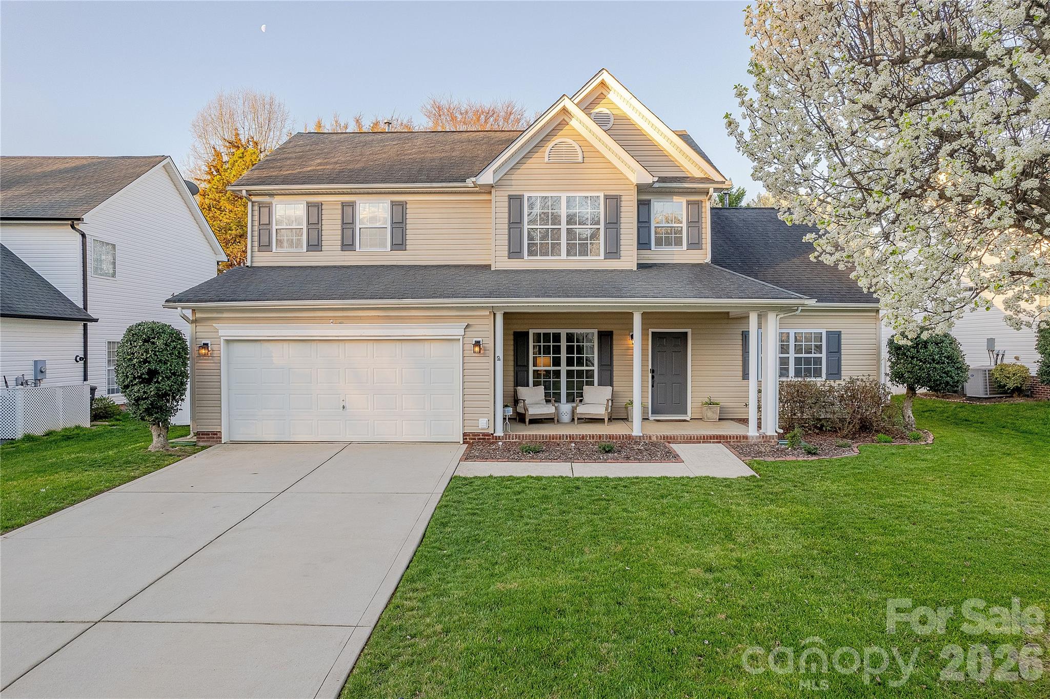 5919 Summer Fog End Fort Mill, SC 29708 - Photo 2 of 41 a front view of a house with patio and garden