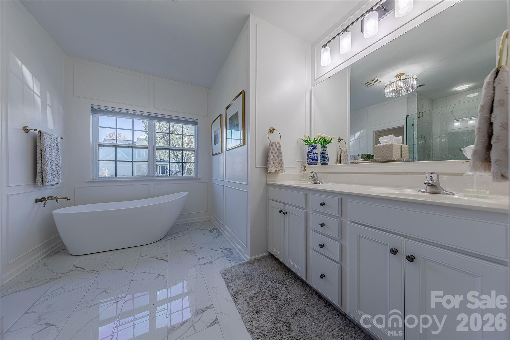 5919 Summer Fog End Fort Mill, SC 29708 - Photo 22 of 41 a spacious bathroom with a double vanity sink mirror and bathtub