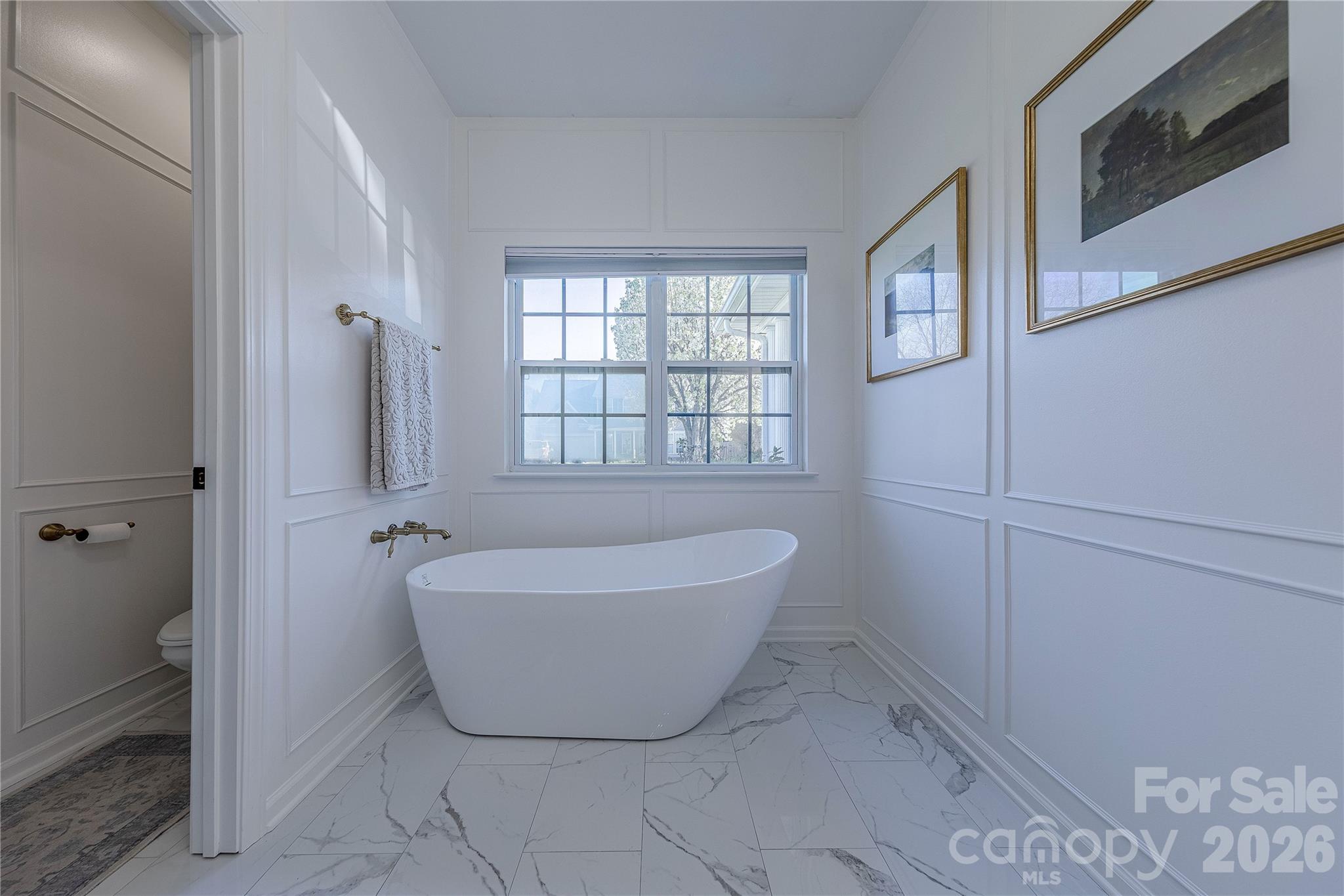 5919 Summer Fog End Fort Mill, SC 29708 - Photo 23 of 41 a bathroom with a bathtub and window
