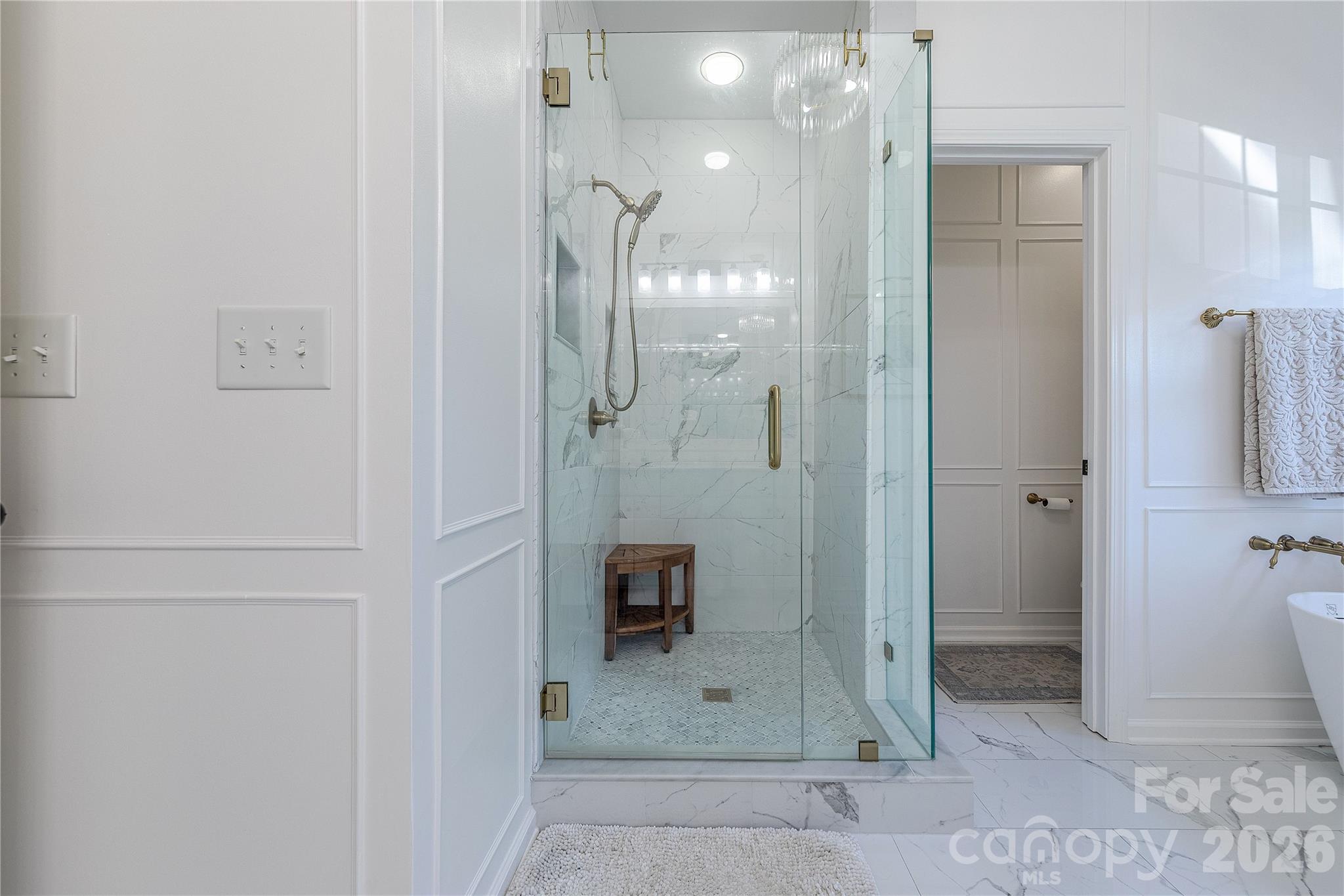 5919 Summer Fog End Fort Mill, SC 29708 - Photo 25 of 41 a bathroom with a glass shower door and a sink