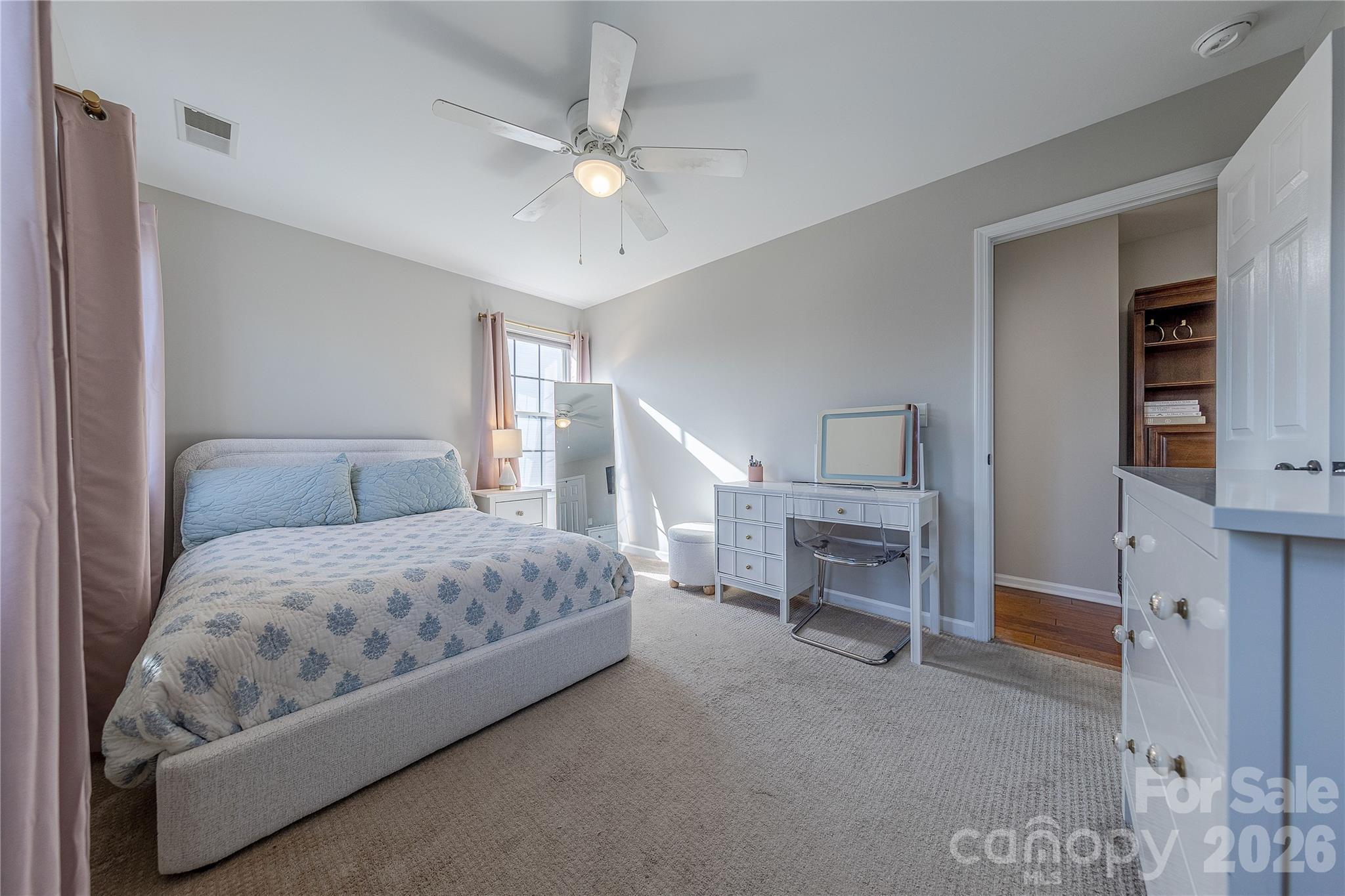 5919 Summer Fog End Fort Mill, SC 29708 - Photo 32 of 41 a spacious bedroom with a bed and a fireplace