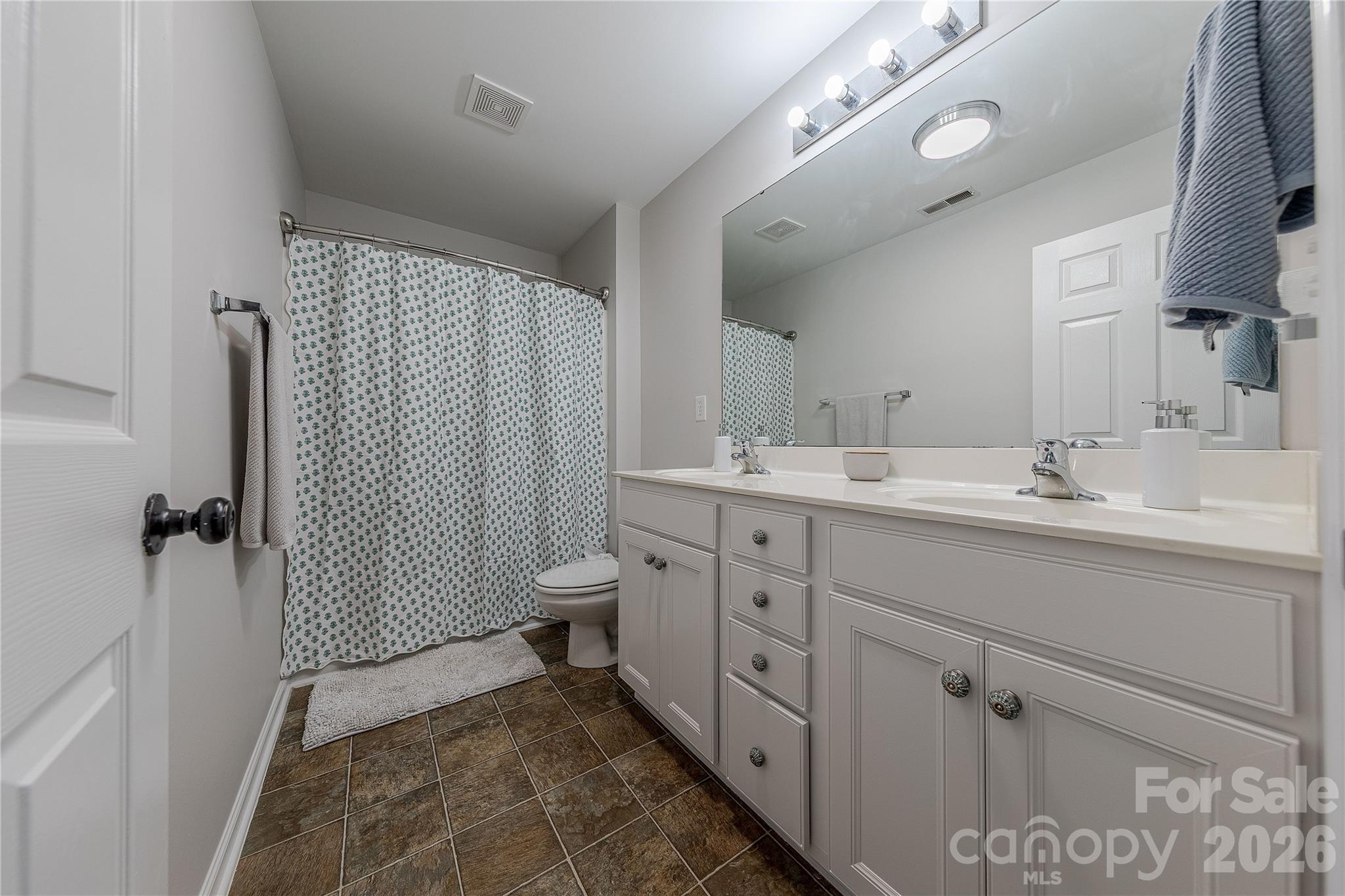5919 Summer Fog End Fort Mill, SC 29708 - Photo 33 of 41 a spacious bathroom with a double vanity sink mirror and toilet