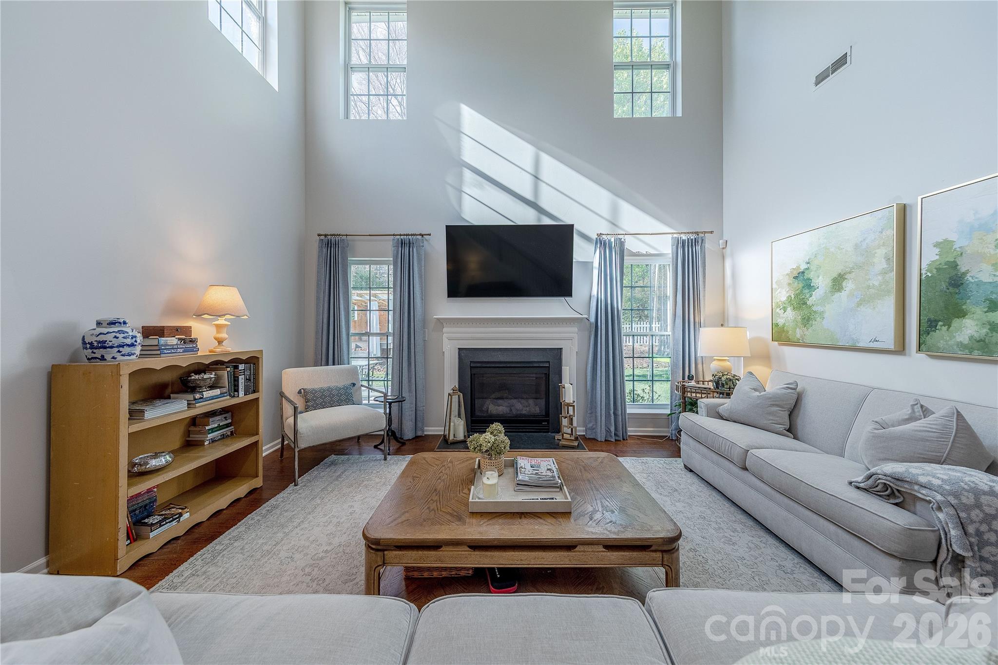5919 Summer Fog End Fort Mill, SC 29708 - Photo 8 of 41 a living room with furniture a flat screen tv and a fireplace
